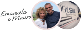Emanuela e Mauro davanti a un camion IdealSedia, sorridenti e all'aperto.